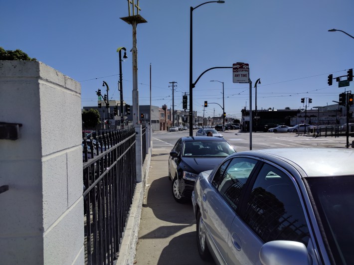 Overflow parking from the Cornerstone Missionary Baptist Church one Sunday, right across from the T-third and multiple bus lines. Photo: Streetsblog/Rudick