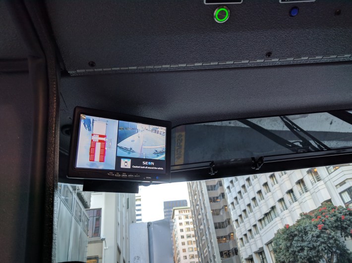 This screen, top left, shows the truck's blind spots, and switches images automatically depending on turn signals and if the truck is moving forward or in reverse.