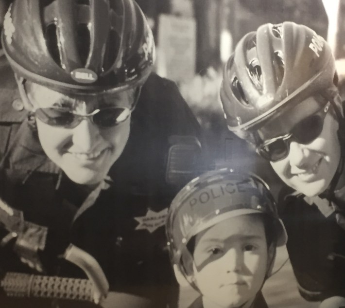 Watson and Rae on patrol with an Oakland civilian. Photo: Oakland PD