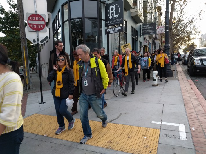 Some 75 people walk solemnly from the Mission to SF City Hall