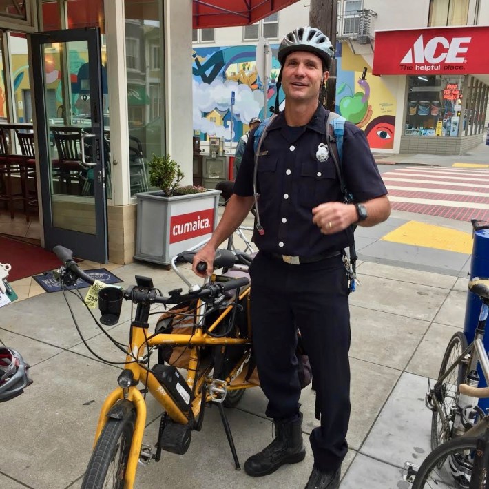 Firefighter Michael Crehan with his bike.