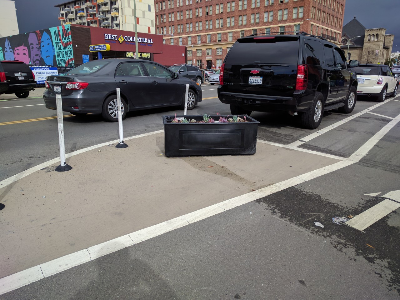 These planters seem to keep cars off the bike lane