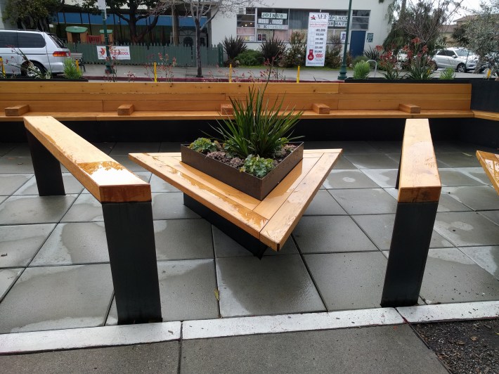 A parklet in Albany. Using a parking space for something other than car storage was unthinkable, until artists and advocates started 'Parking Day'. Photo: Streetsblog/Rudick