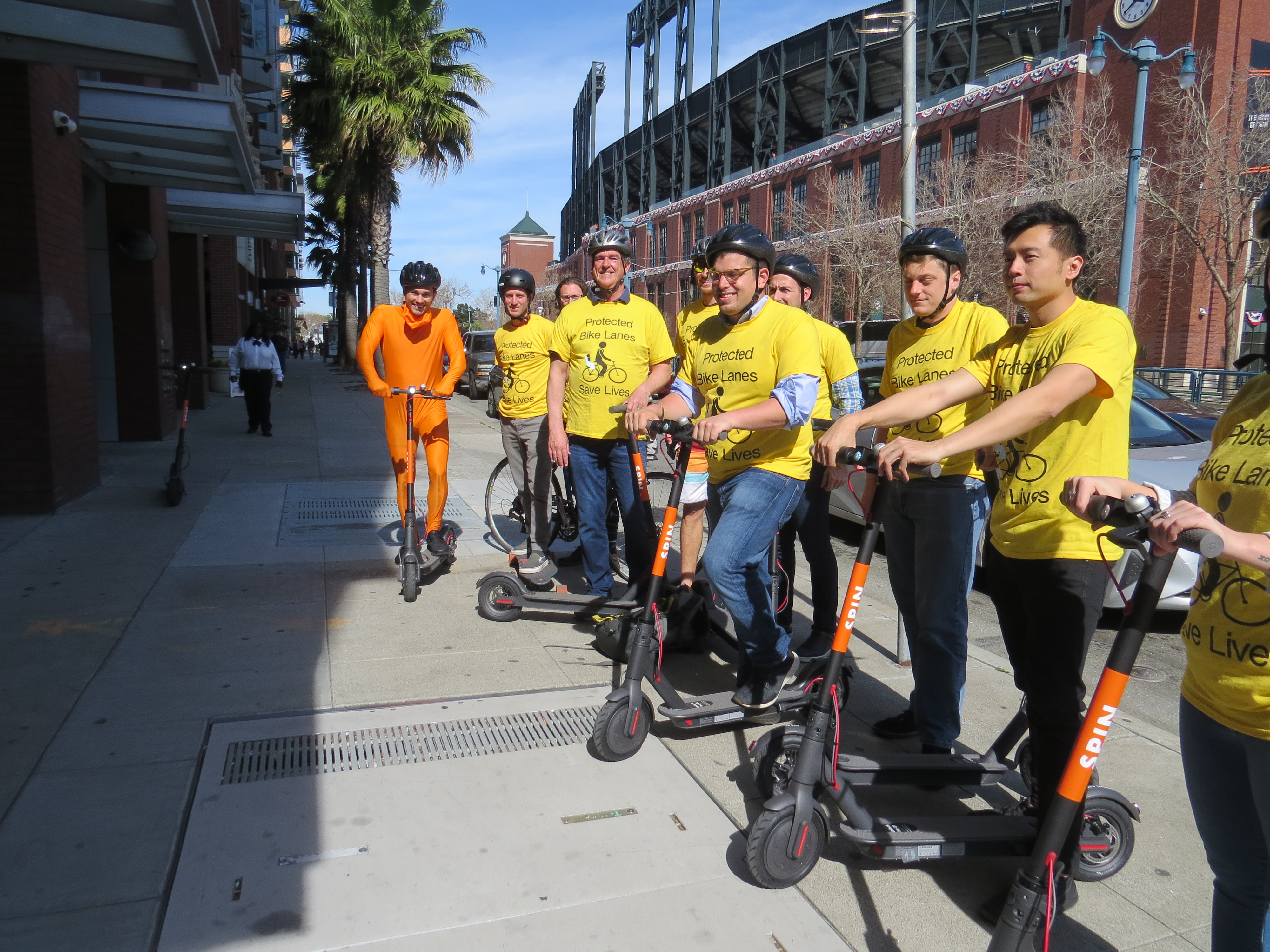 The scooters that pose a grave threat to San Francisco, flaunted in front of the baseball stadium. Photo: Luis Guerra