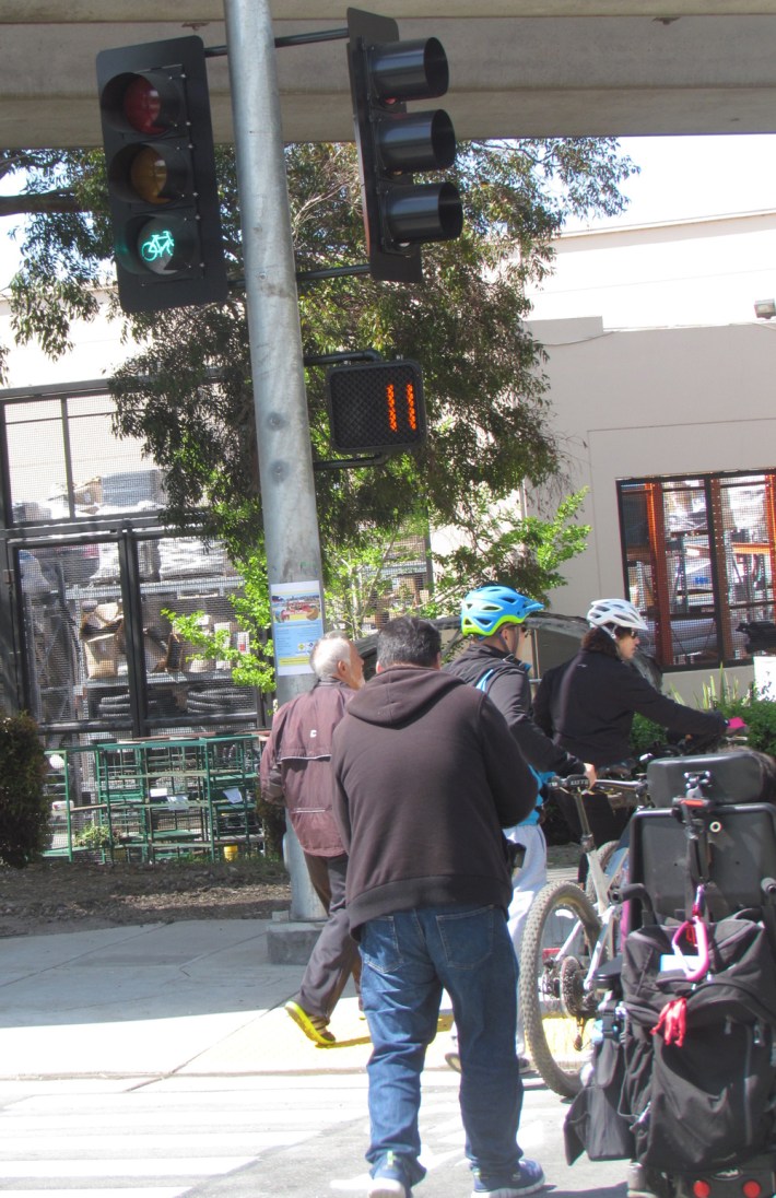 A new bike and pedestrian signal helps people cross San Pablo Avenue at Baxter Creek Park.