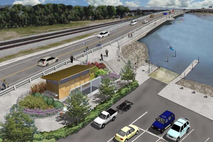The new bridge, connecting Embarcadero to Brooklyn Basin, still has bikes riding on the exposed side of the crash barrier. Image: Bike East Bay's website