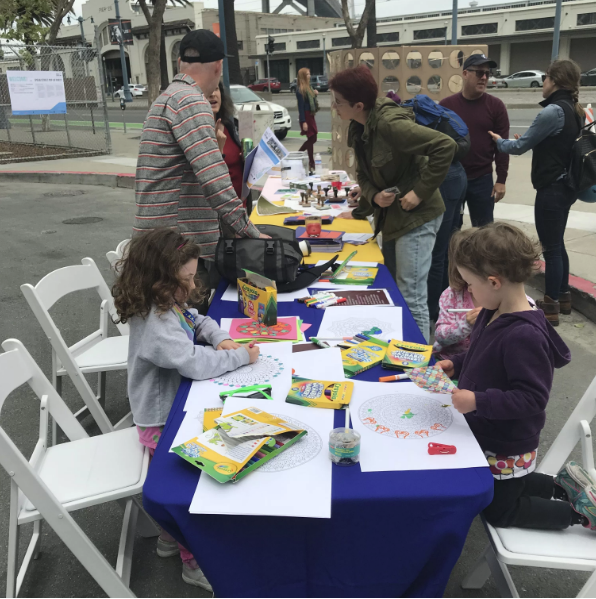 These kids broke the law and did some drawings in the street anyway. Photo: Paul Chasan