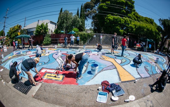 The crew busy working on the mural.