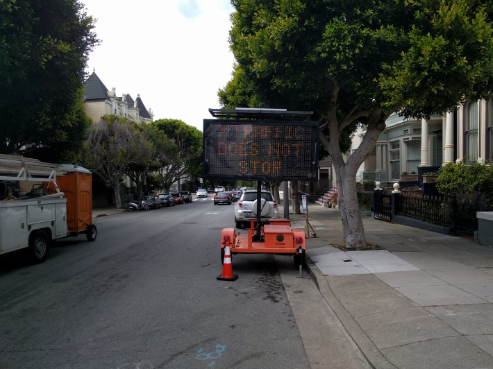 The city added this sign, temporarily at least, to help remind motorists that the intersection has changed