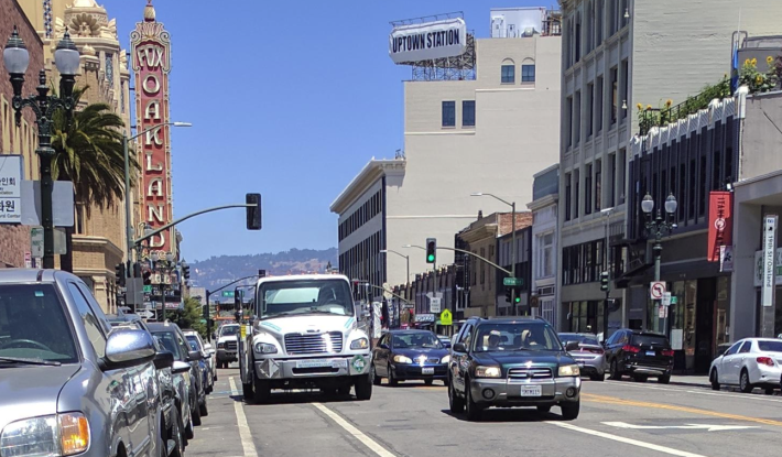 Business as usual just south of the protected bike lanes, with trucks blocking the way (the truck farthest back is an Oakland DOT vehicle). Photo: Streetsblog/Rudick