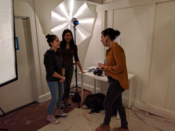 Artist Autumn Swisher teaching photography to students Nicole and Ivy