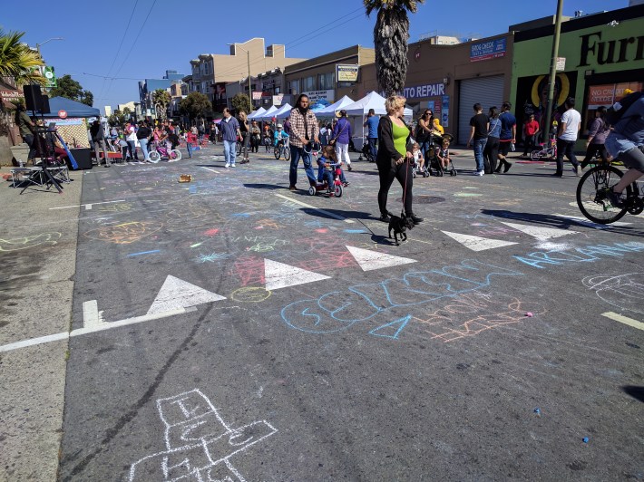 Chalk drawings and hopscotch from kids playing in the street