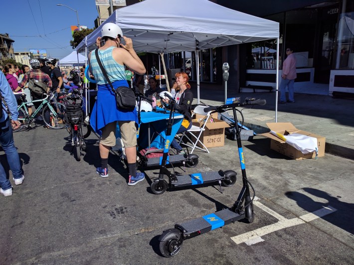 Skip scooters was giving away helmets at their tent at Sunday Streets in the Excelsior