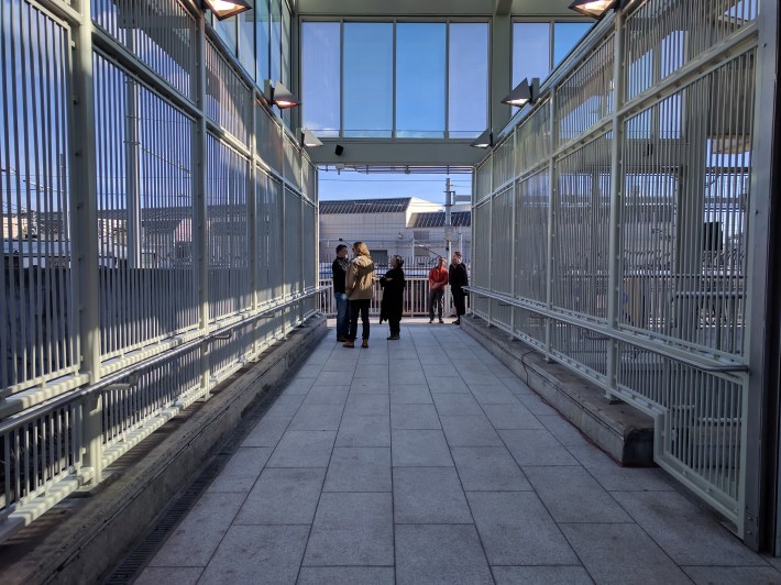 This sheltered crossing on the Ocean side of the station lets riders transfer more easily from Muni to BART