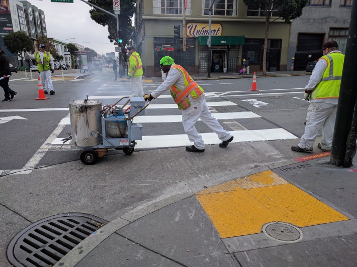 New crosswalks and bike lanes getting painted on Howard today