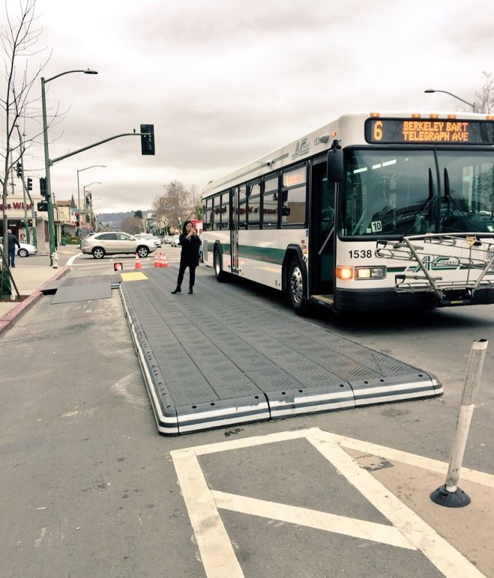 Oakland bus stop platform on Telegraph Avenue using modular plastic components. Photo:TransitCenter
