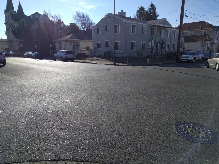 11th and 15th Avenue, at one corner of the school grounds, with no marked crossings at all. Photo: Streetsblog/Rudick