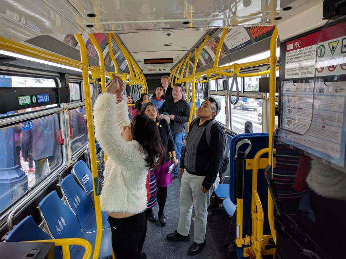 People touring the arts bus in front of City Hall. Photo: Streetsblog/Rudick