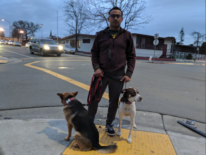 Carrillo walking his dogs in front of the school.