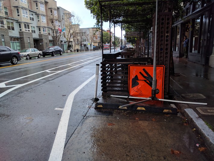 Unfortunately, the parklet in front of Four Barrel coffee wasn't move out to protect the bike lane, so cyclists have to veer back towards auto traffic as they pass the coffee shop