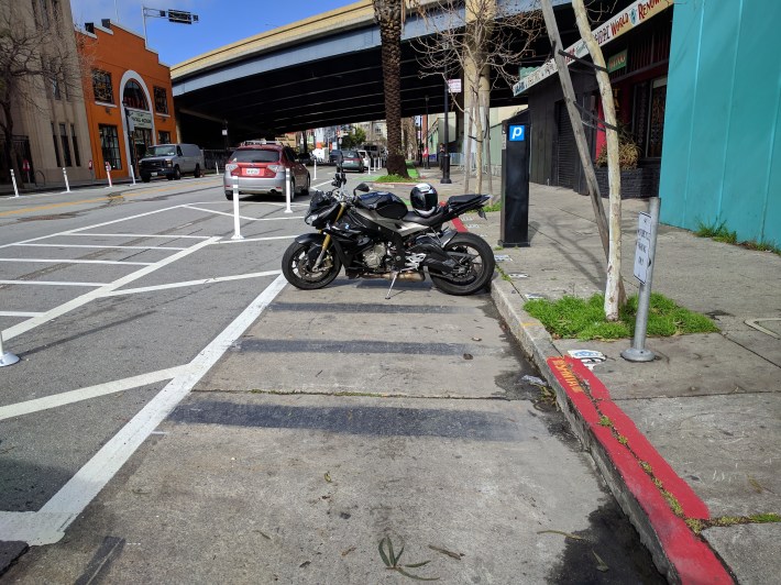 This motorcyclist blocked the bike lane, but it's perhaps understanding as shown in the next picture