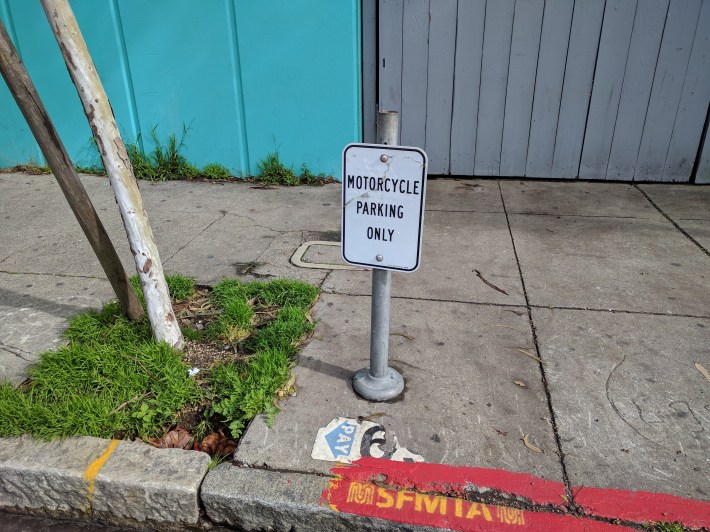 SFMTA forgot to bag this sign, which likely lead to the confusion of the motorcyclist who left his bike blocking the lane