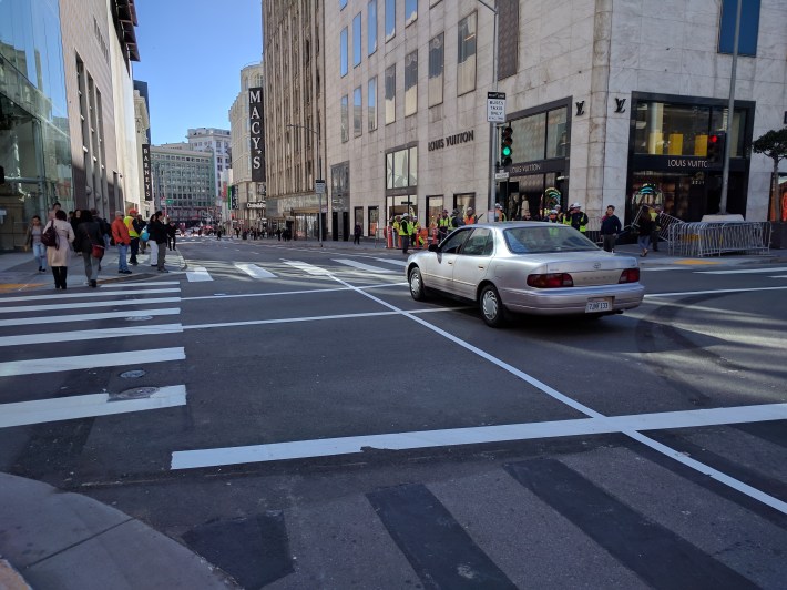 At 1:25 p.m., this Toyota became the first car to drive down this section of Stockton Street in seven years. Photo: Streetsblog/Rudick