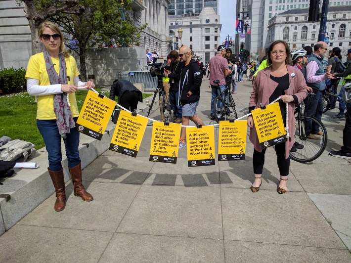 Marta Lindsey and Jodie Medeiros of Walk S.F. were also there to demand safer streets with a banner showing the six people who have died just this year