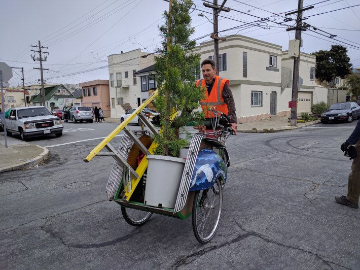 Kai Bansner, another volunteer, used his own rickshaw to move equipment