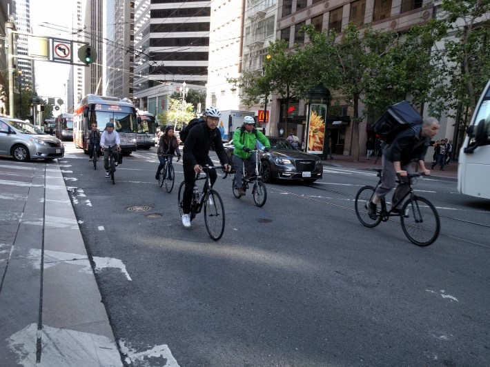 Bikes moving down market, no longer obstructed by gridlocked cars turning right from Montgomery.