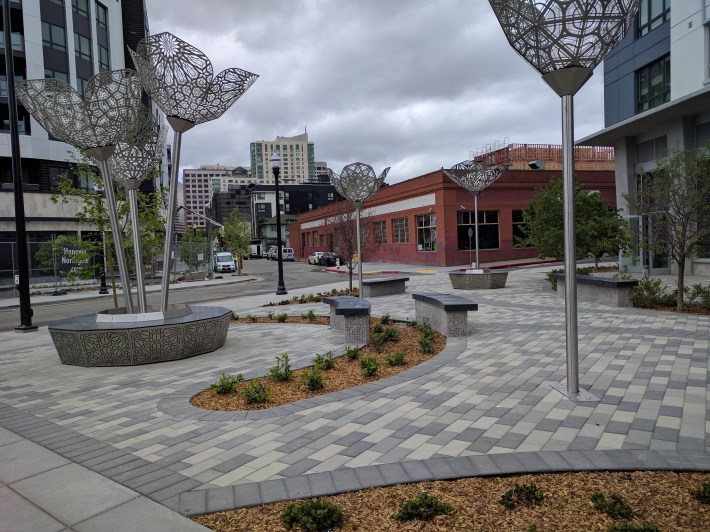 The new pedestrian plaza, where once wide roads and a cut through helped push through cars at high speeds