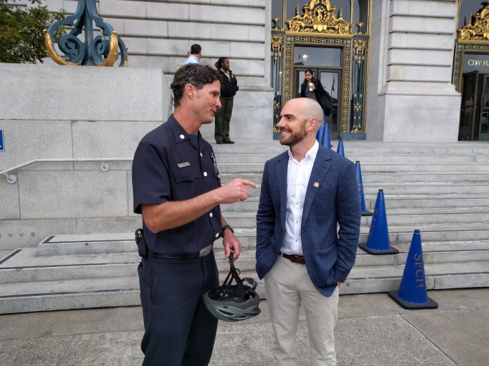 Firefighter Michael Crehan chats with SFBC chief Brian Wiedenmeier at the 'Bike to Work Day' rally