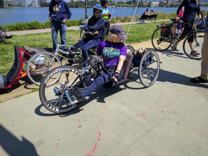 Nicole Parsons rides with her dog Russo