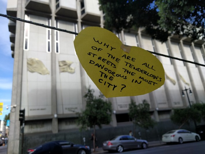 Names of victims and questions were displayed on a string during the vigil