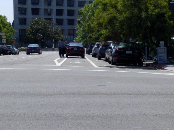 The unprotected bike lane on 9th Street in Oakland, next to Lake Merritt BART... yet another defacto Uber drop-off zone