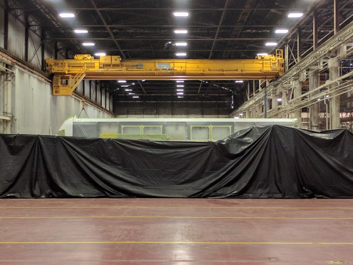 A driverless train gift wrapped and read to ship to Hawaii. When these trains are finished, Bombardier will move in to make the rest of BART's 'fleet of the future'