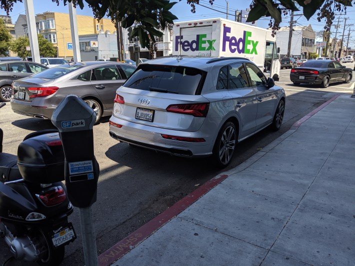 Even under pressure from advocates, Audi continues to park cars illegally. Photo: Parker Day