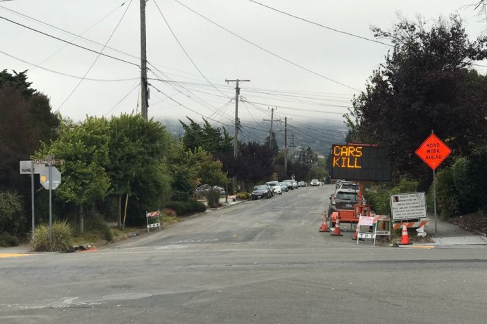 A hacked road sign tells the truth about what's killing people on Berkeley's street. Photo: