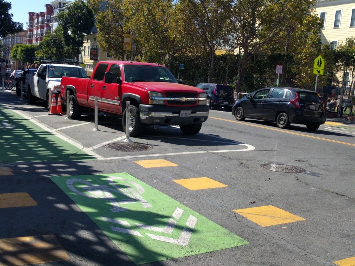 This truck was parked on top of SFMTA's safe-hit posts, demarcating the "daylighting" at the intersection with Clinton Hill. Photo: Streetsblog/Rudick