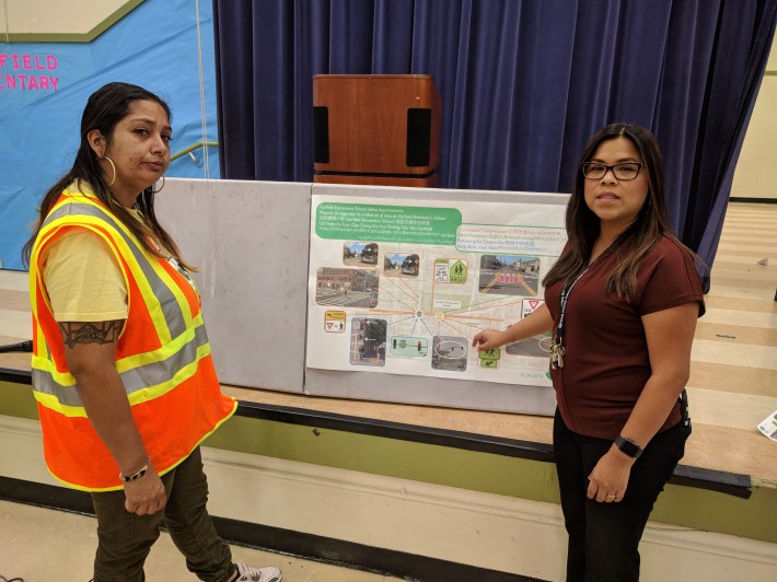 Sam, who has a child at Garfield, with principal Alicia Arenas