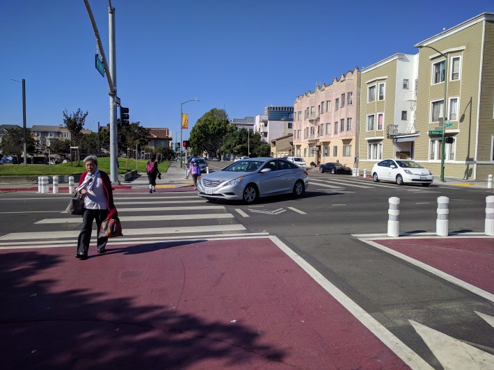 Engineers added a turning pockets to create an opportunity for a huge pedestrian bulb out, seen here at 9th and Madison