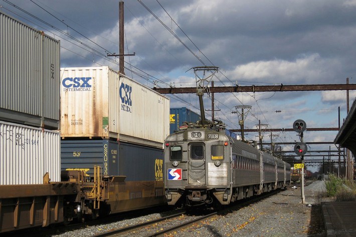 One of the most common reasons given for not electrifying is clearances. But here's a double-stack freight train in Pennsylvania running next to a Philadelphia commuter train.
