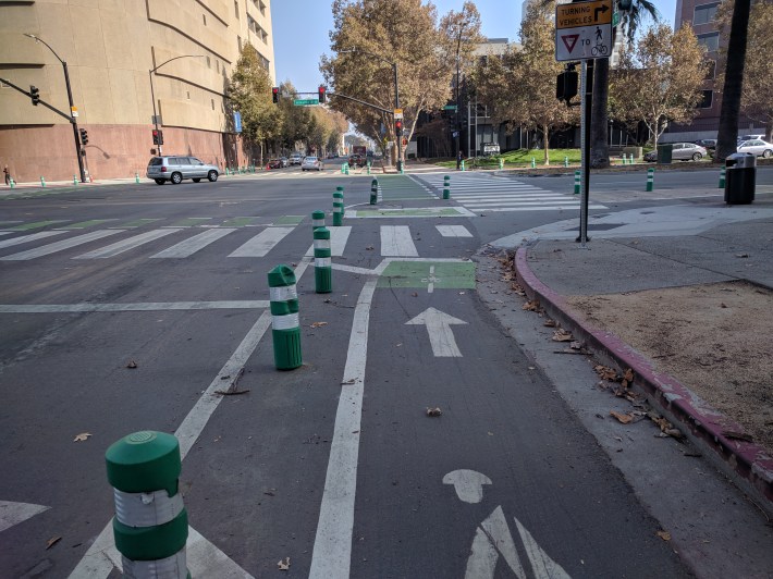 San Jose's new protected bike lane network continues the protection all the way into the intersection
