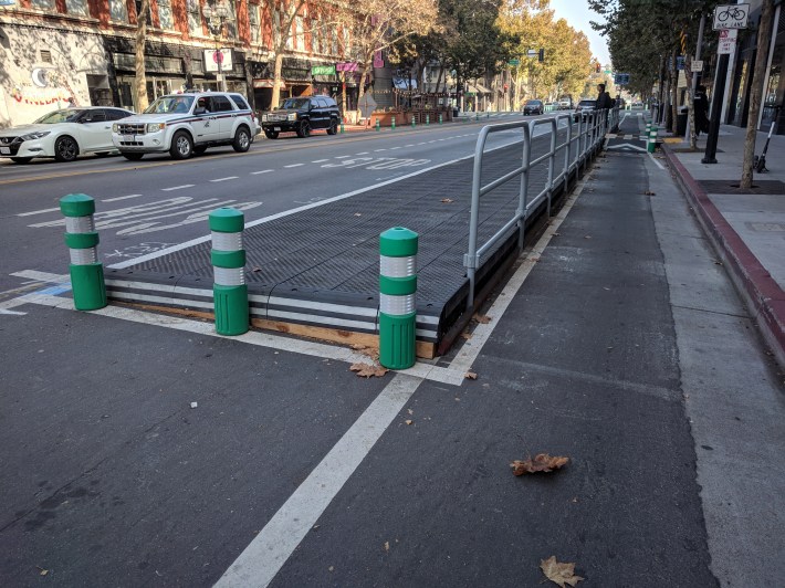 San Jose added bollards and asphalt to improve these quick-build bus boarding islands