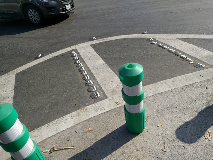 Protected intersections have two radii, which warns drivers that they're taking the turn too close