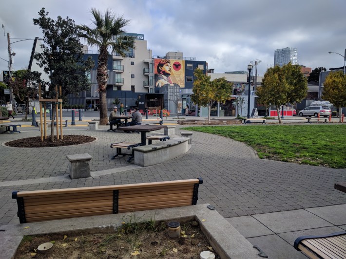 People enjoying a car-free realm at Patricia's Green