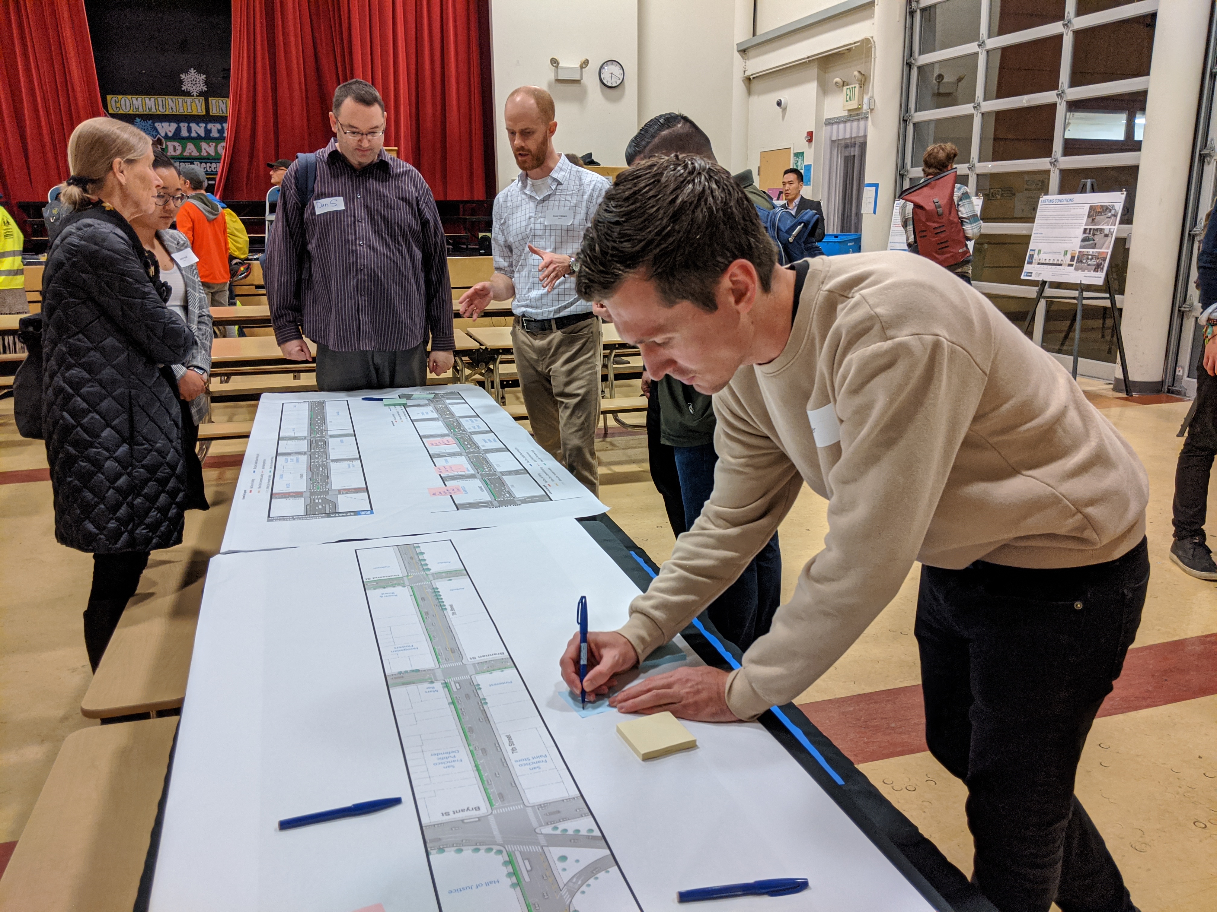Advocate Parker Day makes notes on the plans at last night's open house