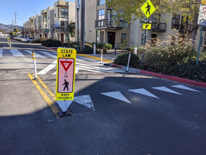 Raised crosswalks, complete with signals and bike sensors, have been added to Doyle Street greenway.
