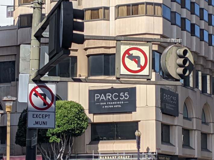 There are already many signs restricting turns onto Market. Photo: Streetsblog/Rudick