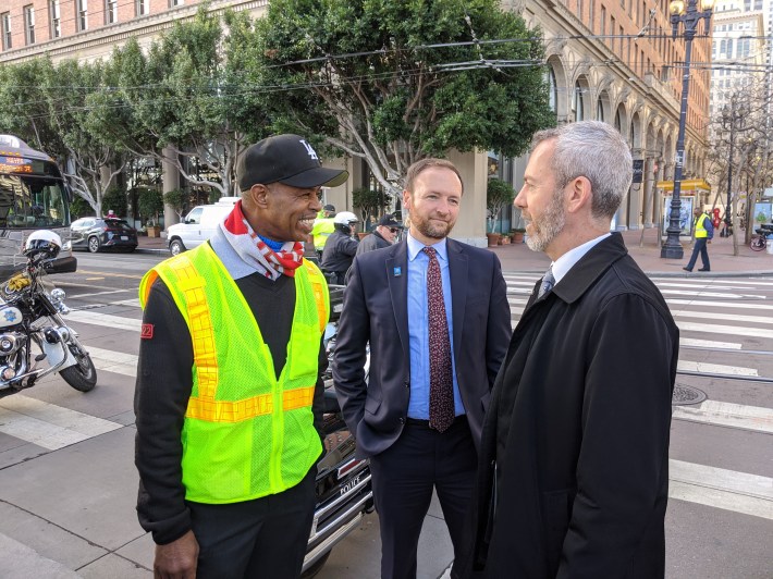 Champion cable-car bell ringer Byron Cobb with SFMTA's Tom Maguire and Jeffrey Tumlin at the ribbon cutting